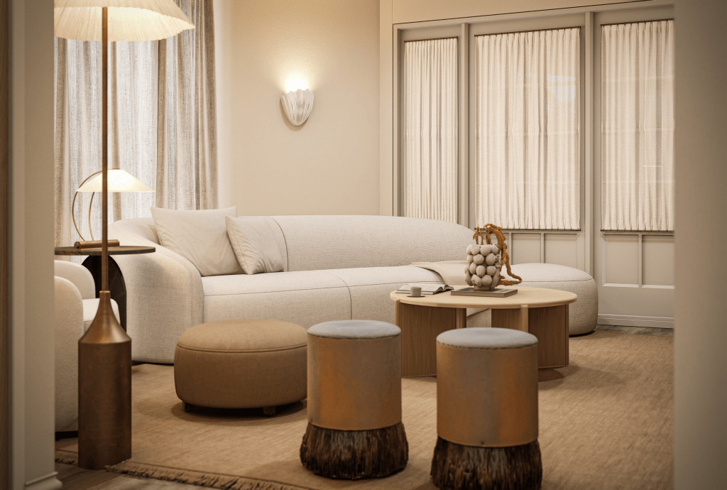 “Sculptural living room with dark marble fireplace and soft curved seating — Galatea Studio’s refined approach to modern English cottage interiors.”