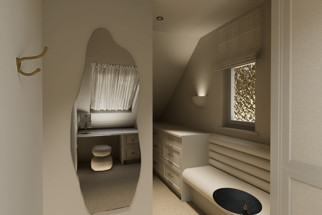 A wide view of a minimalist walk-in wardrobe in Saddleworth featuring a marble-topped island, bespoke handleless cabinetry, and soft-arched doorways.